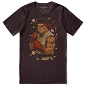 T-shirt with a graphic of a muscular character with a red bandana and boxing gloves on a brown background.