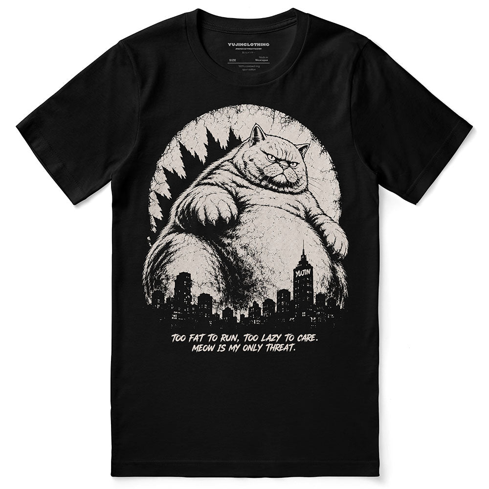 Lazy Colossus Cat T-Shirt in Black, front flat lay with giant cat and city artwork