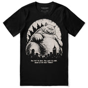 Lazy Colossus Cat T-Shirt in Black, front flat lay with giant cat and city artwork