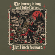 Close-up of Yet I Inch Forward Cat T-Shirt artwork on Military Green