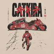 Close-up of Catkira Nine Lives One Road Cat T-Shirt artwork on Soft Cream
