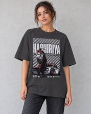 Female model wearing the Hashiriya oversized faded black car T-shirt against a gray wall